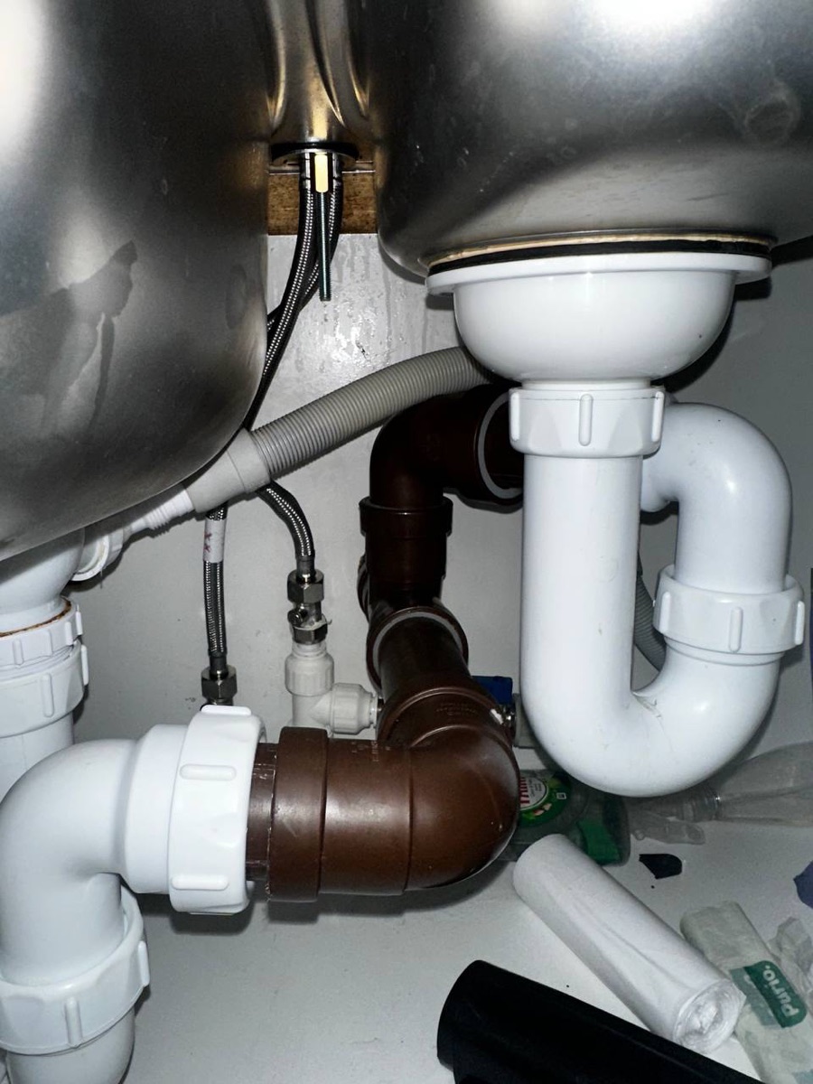Bathroom plumbing — under-sink pipework and fittings