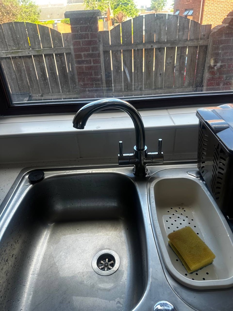 Kitchen plumbing — sink and mixer tap